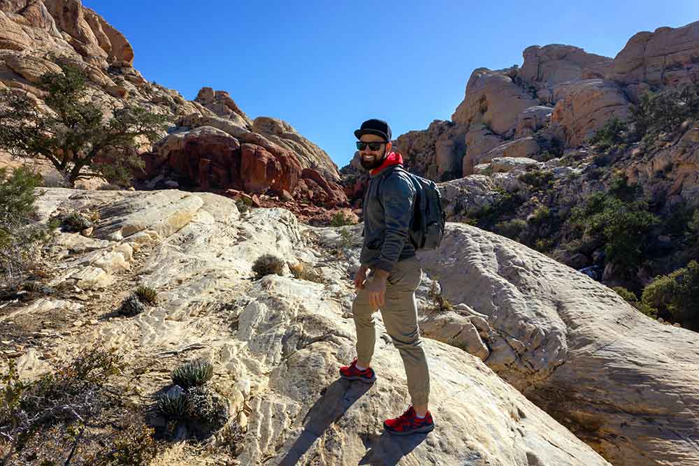 Smiling man in red rock mountains